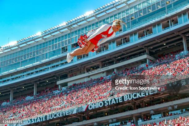 An Ohio State Buckeyes cheerleader performs during the third quarter of the college football game between the Iowa Hawkeyes and Ohio State Buckeyes...