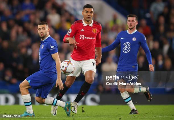 Casemiro of Manchester United in action with Mateo Kovacic and Mason Mount of Chelsea during the Premier League match between Chelsea FC and...