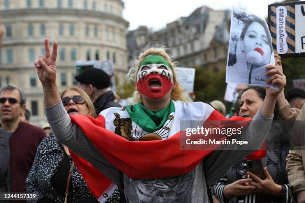 Woman with her face painted with the Iran flag protests in Trafalgar Square on October 22, 2022 in London, England. The protests taking place around...