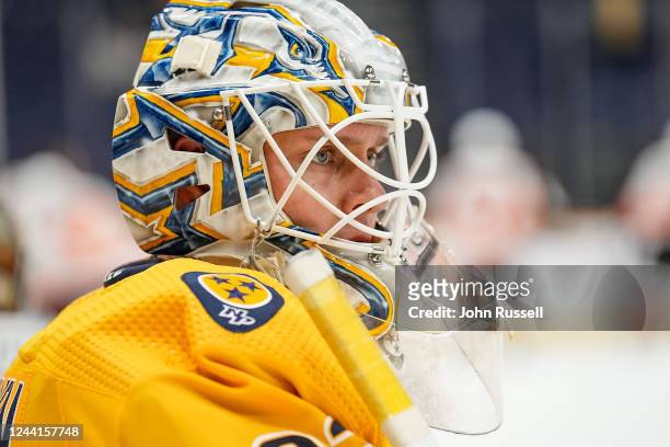 Kevin Lankinen of the Nashville Predators stretches in warmups prior to an NHL game at Bridgestone Arena on October 22, 2022 in Nashville, Tennessee.