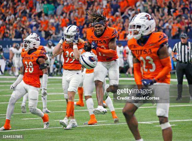 Roadrunners celebrate their victory over North Texas Mean Green as time expires in the second half at the Alamodome on October 22, 2022 in San...