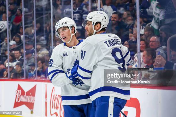 Mitchell Marner and John Tavares of the Toronto Maple Leafs celebrate a first period goal against the Winnipeg Jets at the Canada Life Centre on...