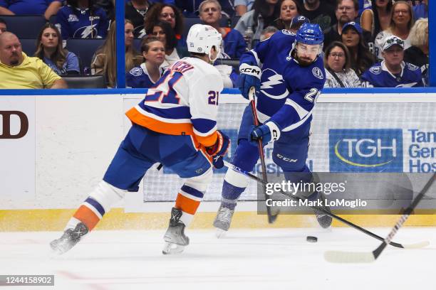 Nicholas Paul of the Tampa Bay Lightning shoots against Kyle Palmieri of the New York Islanders during the second period at Amalie Arena on October...