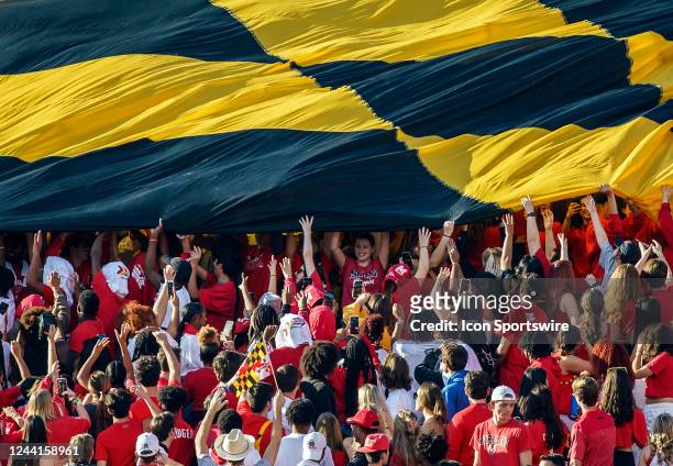 Maryland students help unfurl a giant Maryland State Flag during a Big10 football game between the Maryland Terrapins and the Northwestern Wildcats,...