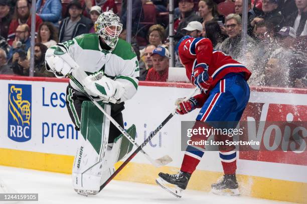 Kirby Dach of the Montreal Canadiens /s by Jake Oettinger of the Dallas Stars during the second period of the NHL game between the Dallas Stars and...