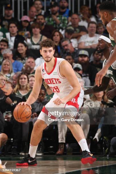 Alperen Sengun of the Houston Rockets dribbles the ball during the game against the Milwaukee Bucks on October 22, 2022 at the Fiserv Forum Center in...