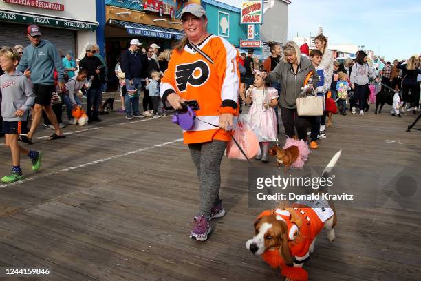 Contestants march in the 400 dog Howl-O-Ween Parade at Ocean City, NJ Boardwalk on October 22, 2022 in Ocean City, New Jersey.