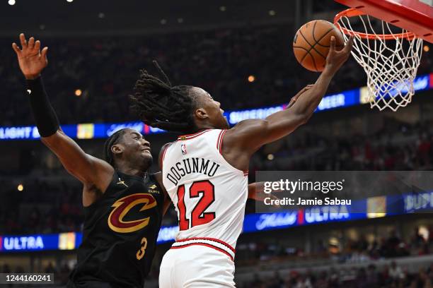 Ayo Dosunmu of the Chicago Bulls attempts a lay up as Caris LeVert of the Cleveland Cavaliers defends in the second half of the game on October 22,...