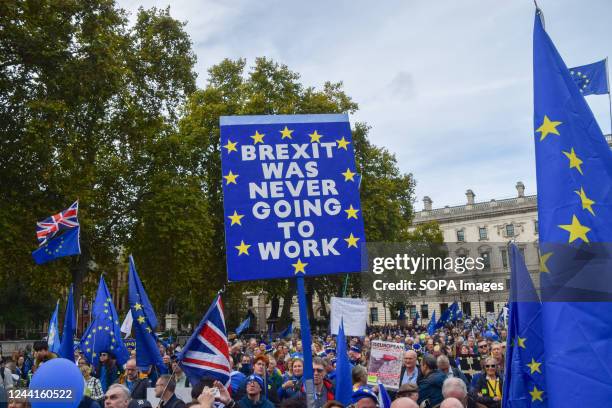 Protester holds an anti-Brexit placard during the demonstration in Parliament Square. Thousands of people marched through Central London demanding...