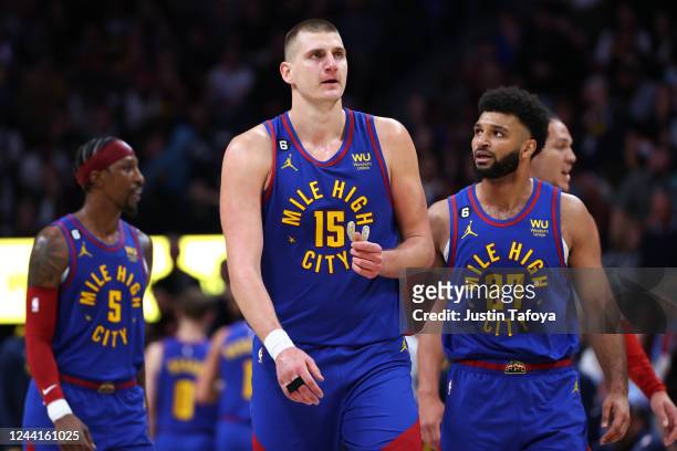 Nikola Jokic and Jamal Murray of the Denver Nuggets talk during a break in the game against the Oklahoma City Thunder at Ball Arena on October 22,...