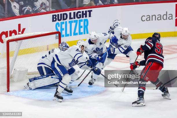 Mark Scheifele of the Winnipeg Jets takes a shot on goal as goaltender Ilya Samsonov, Morgan Rielly, Mitchell Marner and Mark Giordano of the Toronto...