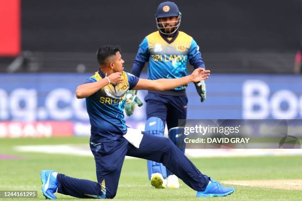 Sri Lanka's Maheesh Theekshana celebrates his wicket of Ireland's Lorcan Tucker during the ICC men's Twenty20 World Cup 2022 cricket match between...