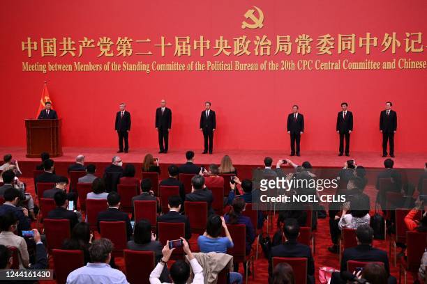 China's President Xi Jinping speaks as he introduces the Communist Party of China's new Politburo Standing Committee, Li Xi, Cai Qi, Zhao Leji, Li...