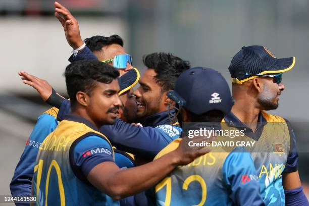 Sri Lanka's Dhananjaya de Silva celebrates his wicket of Ireland's Paul Stirling with teammates during the ICC men's Twenty20 World Cup 2022 cricket...