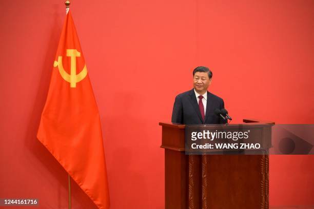 China's President Xi Jinping speaks as he introduces the Communist Party of China's new Politburo Standing Committee, the nation's top...