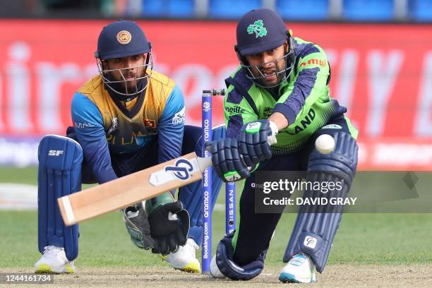 Ireland's Simi Singh plays a shot watched by the Sri Lanka's wicketkeeper Kusal Mendis during the ICC men's Twenty20 World Cup 2022 cricket match...