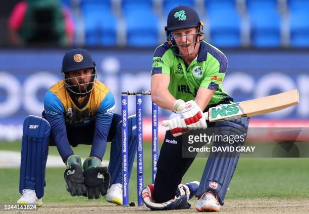 Ireland's Harry Tector plays a reverse shot watched by Sri Lanka's wicketkeeper Kusal Mendis during the ICC men's Twenty20 World Cup 2022 cricket...