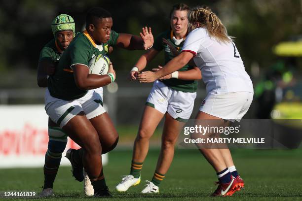 South Africa's Babalwa Latsha fends off England's Connie Powell during the New Zealand 2021 Womens Rugby World Cup Pool C match between England and...