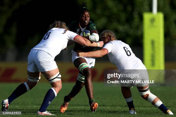 South Africa's Lerato Makua is tackled by England's Poppy Cleall and Morwenna Talling during the New Zealand 2021 Womens Rugby World Cup Pool C match...