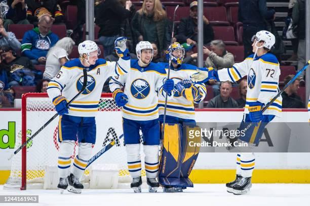 Rasmus Dahlin and Tage Thompson of the Buffalo Sabres celebrate after defeating the Vancouver Canucks after their NHL game at Rogers Arena October...