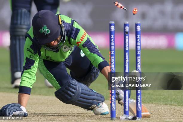 Ireland's Simi Singh gains his ground against a run out attempt during the ICC men's Twenty20 World Cup 2022 cricket match between Sri Lanka and...