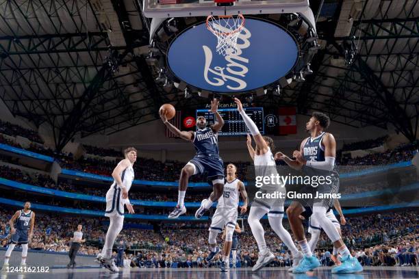 Tim Hardaway Jr. #11 of the Dallas Mavericks drives to the basket against the Memphis Grizzlies on October 22, 2022 at the American Airlines Center...