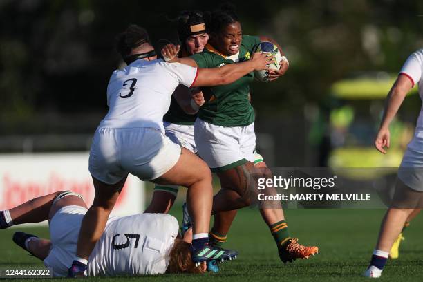 South Africa's Roseline Botes is tackled by England's Maud Muir and England's Cath O'Donnell during the New Zealand 2021 Womens Rugby World Cup Pool...