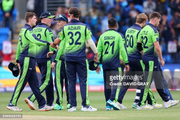 Ireland players walk off the field after their loss during the ICC men's Twenty20 World Cup 2022 cricket match between Sri Lanka and Ireland at...