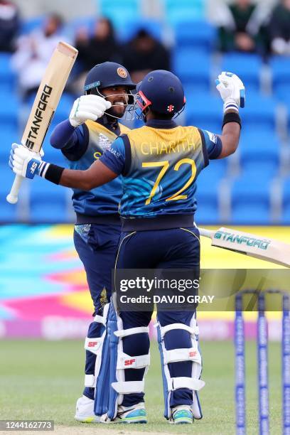 Sri Lanka's Kusal Mendis and Sri Lanka's Charith Asalanka celebrate their win during the ICC men's Twenty20 World Cup 2022 cricket match between Sri...