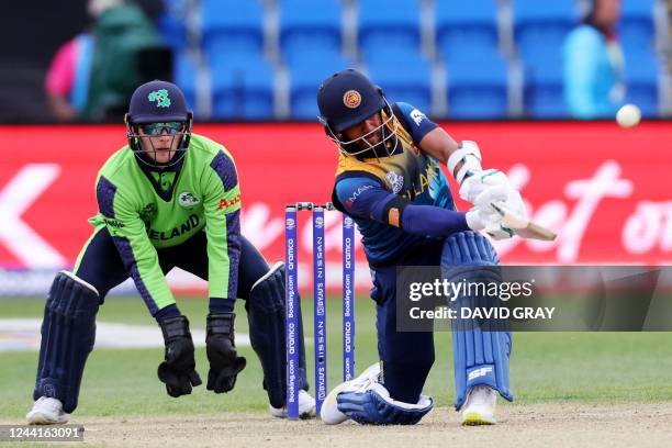 Sri Lanka's Kusal Mendis plays a shot over the boundary line for six runs to win the ICC men's Twenty20 World Cup 2022 cricket match between Sri...