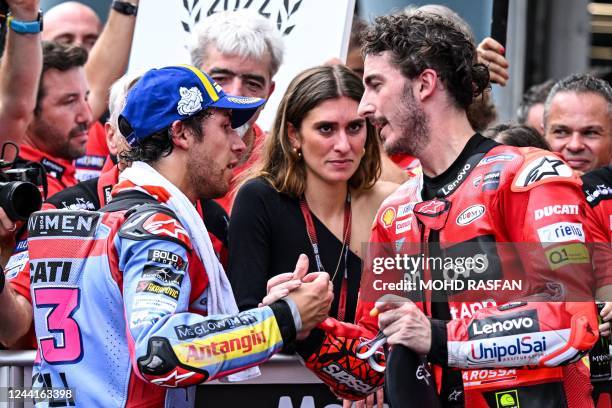 Second-placed Ducati Gresini Racing's Italian rider Enea Bastianini congratulates winner Ducati Lenovo's Italian rider Francesco Bagnaia after the...