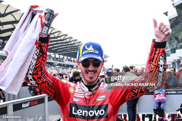 Winner Ducati Lenovo's Italian rider Francesco Bagnaia celebrates after the MotoGP Malaysian Grand Prix motorcycle race at the Sepang International...