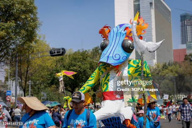 An Alebrije passes over Paseo de la Reforma during the Parade of Monumental Alebrijes. The 14th edition of the Monumental Alebrijes Parade takes...