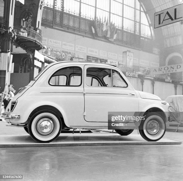 Fiat 500 version C with sunroof car is displayed on October 06, 1959 at the 46th Paris Motor Show, at the Grand Palais in Paris. An emblematic model...