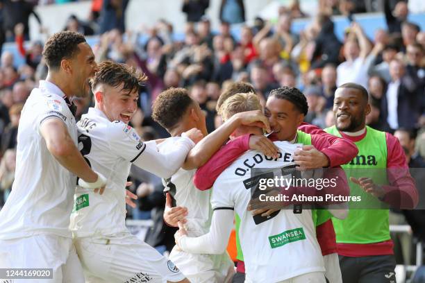 Oliver Cooper of Swansea City celebrates his goal with team mates during the Sky Bet Championship match between Swansea City and Cardiff City at the...