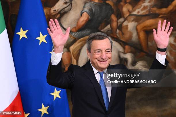 Italy's outgoing prime minister, Mario Draghi waves after the cabinet minister bell handover ceremony at Palazzo Chigi in Rome on October 23, 2022. -...