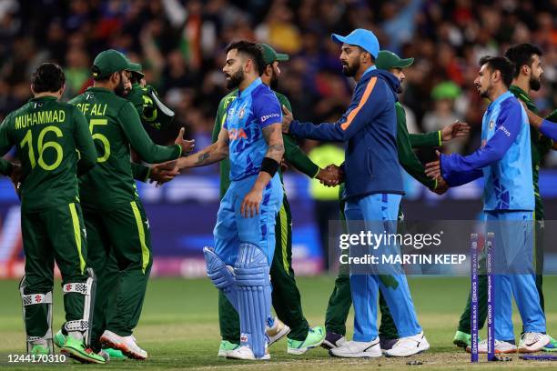 Players from both teams shake hands after the ICC men's Twenty20 World Cup 2022 cricket match between India and Pakistan at Melbourne Cricket Ground...