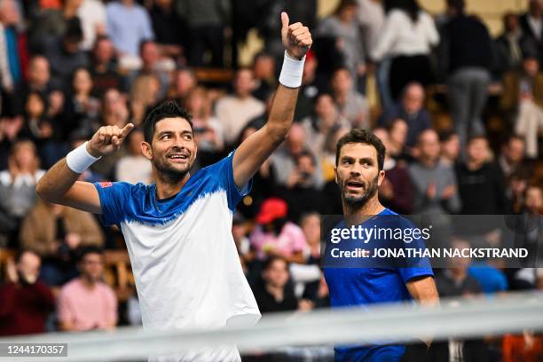 Marcelo Arevalo of El Salvador celebrates with Jean-Julien Rojer of the Netherlands after winning the Doubles final match against Lloyd Glasspool of...