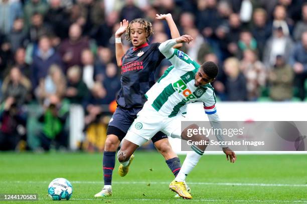 Xavi Simons of PSV, Laros Duarte of FC Groningen during the Dutch Eredivisie match between FC Groningen v PSV at the Hitachi Capital Mobility Stadion...