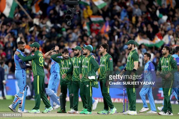 India's Hardik Pandya shakes hands with Pakistan players after the ICC men's Twenty20 World Cup 2022 cricket match between India and Pakistan at...