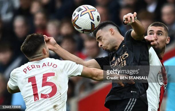 Southampton's French defender Romain Perraud vies with Arsenal's Brazilian midfielder Gabriel Martinelli to header the ball during the English...