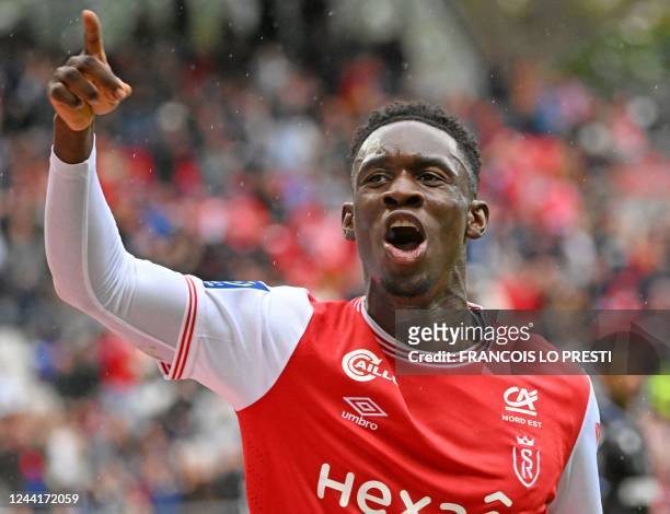 Reims' English forward Folarin Balogun celebrates scoring his team's first goal during the French L1 football match between Stade de Reims and AJ...