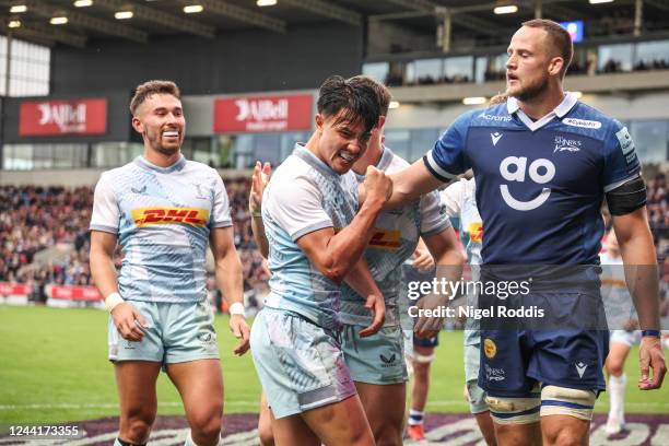 Marcus Smith of Harlequins reacts after scoring a try during the Gallagher Premiership Rugby match between Sale Sharks and Harlequins at Salford City...