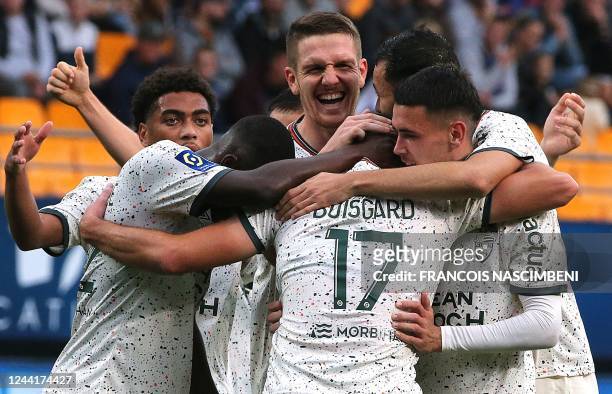 Lorient's midfielder Quentin Boisgard celebrates with team mates after scoring a goal during the French L1 football match between Troyes and Lorient...