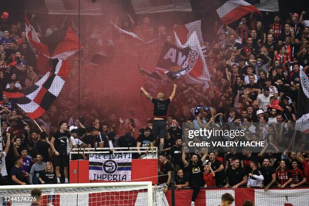 Nice supporters wave flags as they cheer their team during the French L1 football match between OGC Nice and FC Nantes at the Allianz Riviera Stadium...