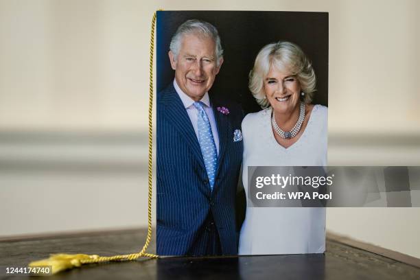 Close-up of the front of one of the first birthday cards celebrating 100 years of age, which have been signed by King Charles III and Camilla, Queen...