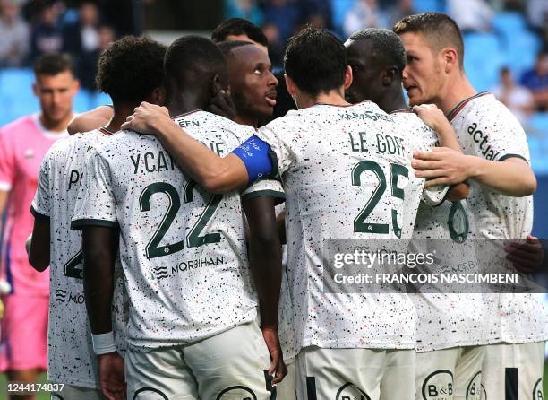 Lorient's forward Stephane Diarra celebrates with team mates after scoring a goal during the French L1 football match between Troyes and Lorient on...