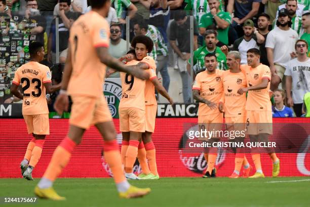 Atletico Madrid's players celebrate after Atletico Madrid's French forward Antoine Griezmann scored his team's second goal during the Spanish league...