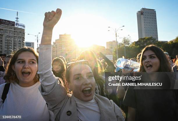Women shout in the front of the Romanian government headquarters during a march called "Together for Women's Safety!" in Bucharest, Romania, on...