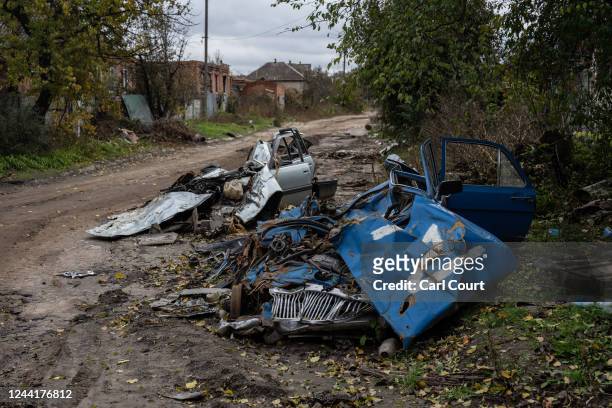 Lada with a Russian army 'Z' mark lies ruined after being run over by a tank during fighting between Ukrainian and Russian occupying forces, on...